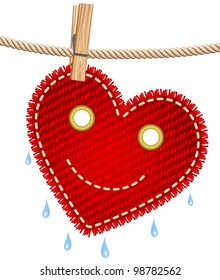 Textile red heart drying on a clothesline