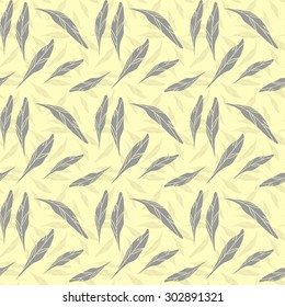 Textile seamless pattern, messed up feathers on tender yellow background. Eps10 vector file