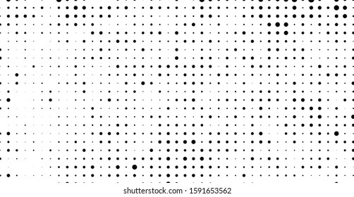 The texture of halftone. Abstract background of black dots on white