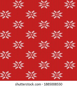 texture of a knitted red fabric with a white pattern in the form of snowflakes