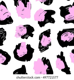 The texture of the leopard spots. Leopard pattern for textiles. Pink-black spots on a white background.