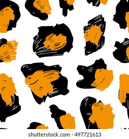 The texture of the leopard spots. Leopard pattern for textiles. Yellow-black spots on a white background.