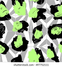 The texture of the leopard spots. Leopard pattern for textiles. Green-black spots on the background with geometric pattern.