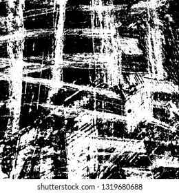 The texture of paint strokes with a dry brush. Grunge background black and white. Monochrome vintage surface in stains, dust and dirt. Gloomy pattern of scuffs, wear, cracks, chips