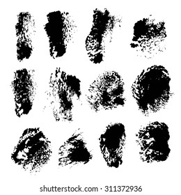 Texture smears of black dry paint spots on white paper 1