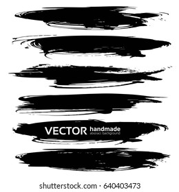 Textured abstract black strokes of thick paint isolated on a white background