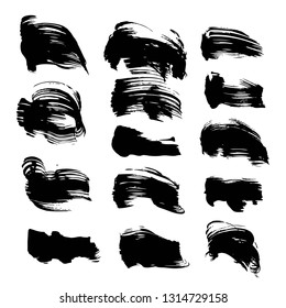 Textured black strokes of thick paint isolated on white background