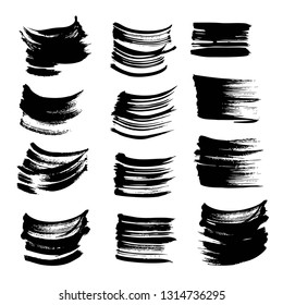 Textured black strokes of thick paint set isolated on white background