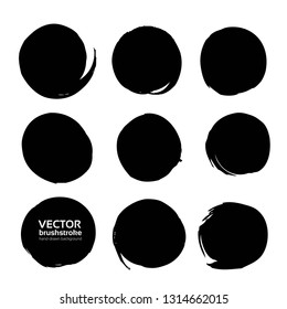 Textured circles black thick paint isolated on white background