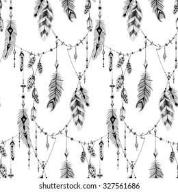 Textured feathers and crystals in aztec (boho) style. Seamless pattern.
