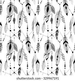 Textured feathers and crystals in aztec (boho) style. Seamless pattern.