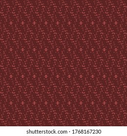 Textured geometric pattern with rhombuses and dots. Wallpaper in shades of burgundy red. Textile fabric.