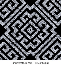 Textured grunge seamlrss pattern. Tribal ethnic style vector stippled background. Dotted geometric greek key, meanders ornament with stipples, dots, geometrical shapes. Ornate endless repeat texture.