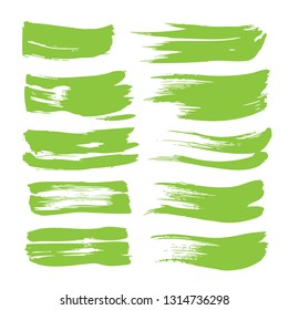 Textured lime green strokes of thick paint set isolated on white background