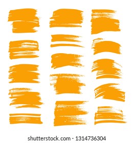 Textured orange strokes of thick paint set isolated on white background