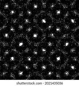Textured pattern with polka dots and circles. Circular effects and white spots on a black background.