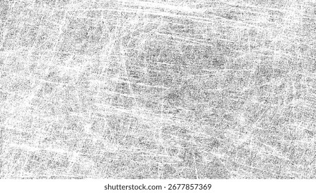 Una superficie texturizada con arañazos e imperfecciones grises y blancas.