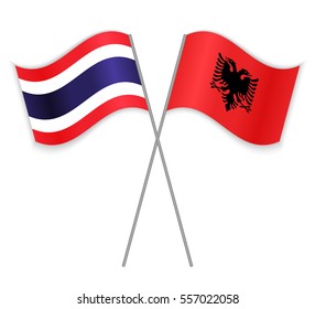 Thai and Albanian crossed flags. Thailand combined with Albania isolated on white. Language learning, international business or travel concept.