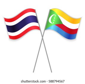 Thai and Comoran crossed flags. Thailand combined with Comoros isolated on white. Language learning, international business or travel concept.
