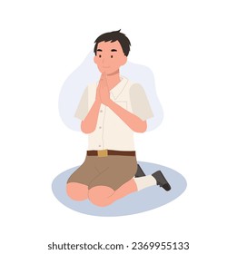 Thai Culture concept. Thai student boy is sitting and praying , making wai. Praying Gesture