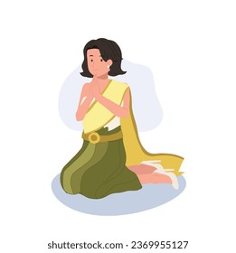 Thai Culture concept. Thai woman in traditional dress is sitting and praying , making wai. Praying Gesture