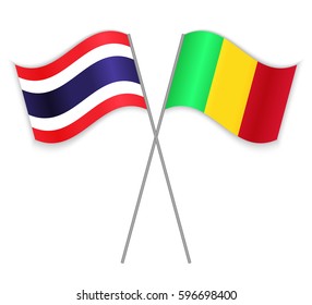 Thai and Malian crossed flags. Thailand combined with Mali isolated on white. Language learning, international business or travel concept.