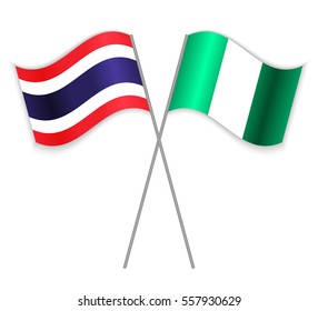 Thai and Nigerian crossed flags. Thailand combined with Nigeria isolated on white. Language learning, international business or travel concept.