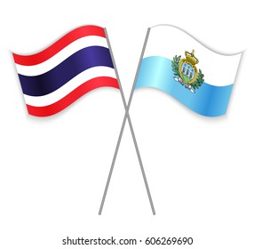 Thai and Sammarinese crossed flags. Thailand combined with San Marino isolated on white. Language learning, international business or travel concept.