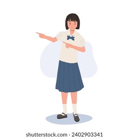 Estudiante tailandés con uniforme apuntando al presente. Educación, aprendizaje escolar y alegría juvenil