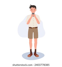 Thai Student in Uniform Using Smartphone for Modern Education