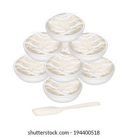 Thai Traditional Dessert, Pile of Kanom Gluay or Banana Sweetmeat Made From Coconut, Banana, Flour and Sugar in A Bowl with Spoon. 