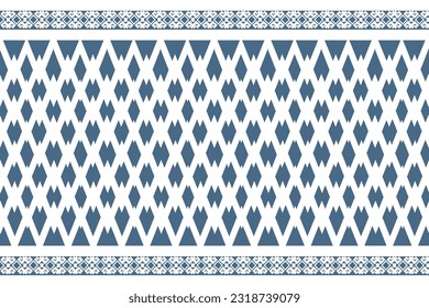 Thai traditional weaving pattern for fabric design. White silk pattern on indigo background. Indigo-dyed cotton fabric in the Northeast of Thailand. Mudmee silk pattern for woven fabric design.