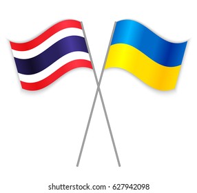 Thai and Ukrainian crossed flags. Thailand combined with Ukraine isolated on white. Language learning, international business or travel concept.