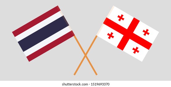 Thailand and Georgia. Crossed Thai and Georgian flags. Official colors. Correct proportion. Vector illustration
