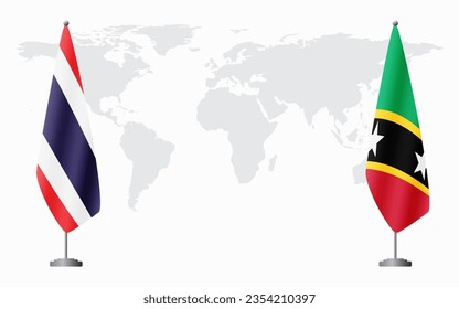 Thailand and Saint Kitts and Nevis flags for official meeting against background of world map.