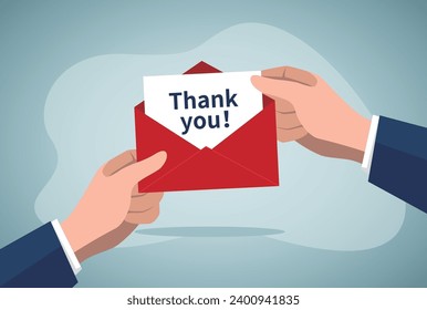 Thank you card. Hand is showing red envelope with Thank You card.