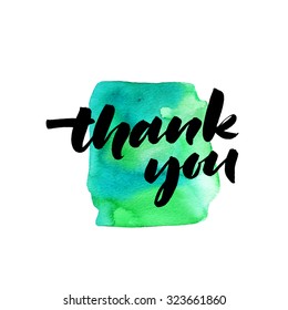 Thank you card, ink hand lettering. Abstract green watercolor background.
