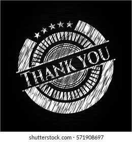 Thank you chalkboard emblem written on a blackboard