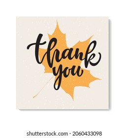 Thank you compliment card with handwritten text and autumn leaves. Hand lettering typography isolated on white background. Vector illustration.  Modern brush ink calligraphy