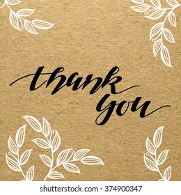 Thank You hand calligraphic handmade title on carton paper with flowery ornament. Scrapbook sketch.