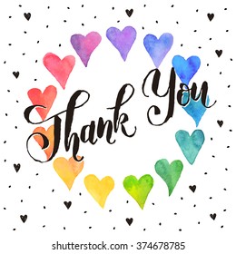 Thank you lettering with watercolor hearts on background. Modern calligraphy.  Colorful  frame from watercolor hearts. Bright watercolor romantic card template. 