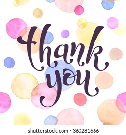 Thank you lettering with watercolor spots on background. Modern calligraphy. Thank you postcard template. 