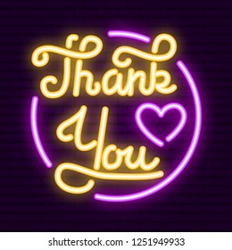 Thank you - neon inscription, heart and round frame on the brick wall. Greeting card. Hand drawn calligraphy. 