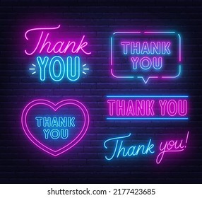 Thank You set neon sign on brick wall background.