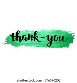 Thank You vector hand written calligraphic lettering on
green watercolor background. Thanksgiving gratitude greeting card. Handmade
concept.
