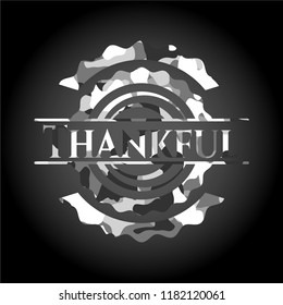 Thankful written on a grey camouflage texture