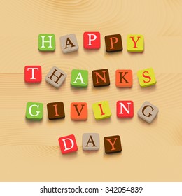 Thanksgiving day background colorful letters on wooden background. Vector illustration