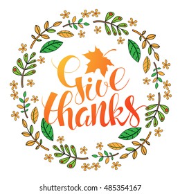 Thanksgiving Day card. Handwritten calligraphy inscription  with orange maple leaf.  Wreath of autumn leaves and flowers. Vector illustration. Logotype.