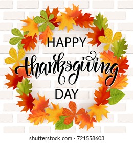 Thanksgiving day hand drawn lettering. Autumn leaves background. Vector illustration EPS10.