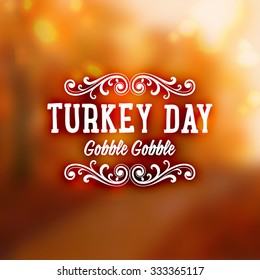 Thanksgiving Day Holiday Typographic Design. Calligraphic Elements. Blurred Autumn Forest Background.